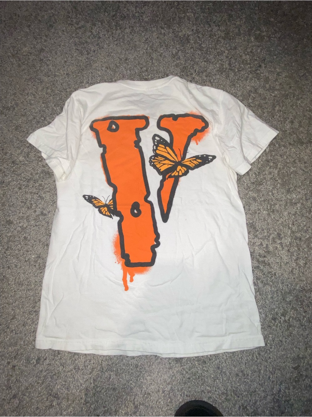 White  Graphic Tee with Orange 'V' and Butterfly Design